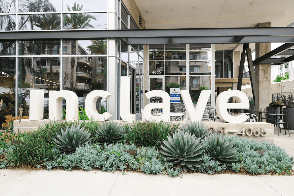 a sign in front of a building that says in clear